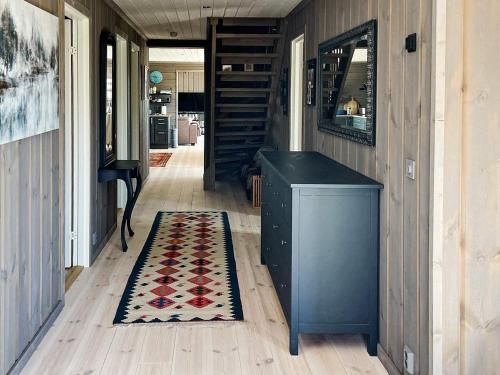 a hallway with a rug on a wooden floor at 10 person holiday home in NESBYEN-By Traum in Nesbyen