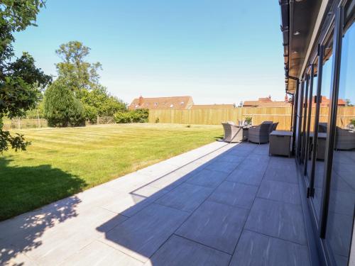 a patio with a view of a yard at Scottwil in York