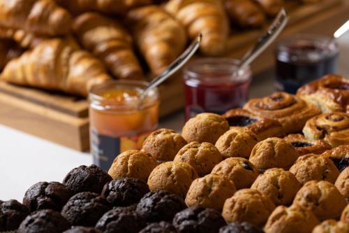 a bunch of donuts and other pastries on a table at Residence Inn by Marriott Manchester Piccadilly in Manchester