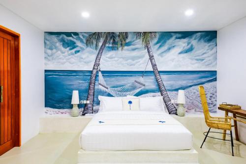 a bedroom with a bed and two palm trees at Lombok Khophilauvillas in Kuta Lombok