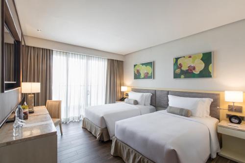 Cama o camas de una habitación en Dusit Thani Mactan Cebu Resort