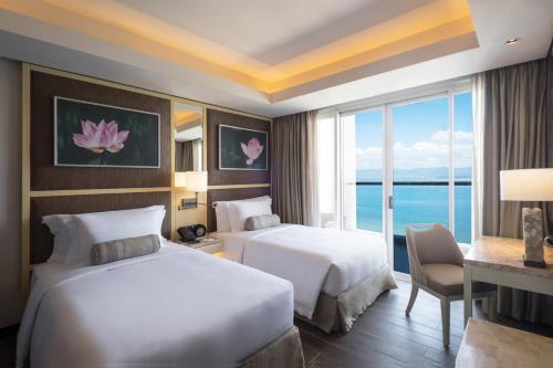 Cama o camas de una habitación en Dusit Thani Mactan Cebu Resort