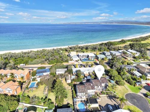 an aerial view of a resort next to the beach at Calendo Apartments in Merimbula