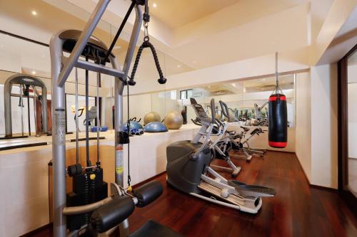 a gym with treadmills and elliptical machines at Villa Jamalu by Nakula in Jimbaran