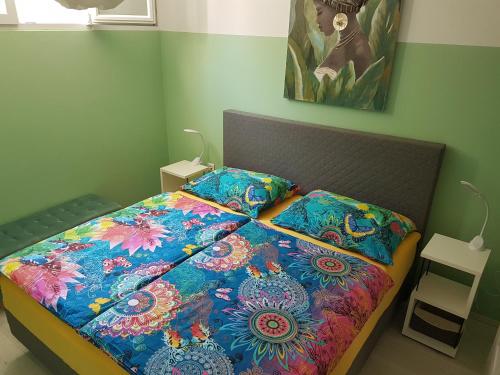 A bed or beds in a room at Apartma IRENA