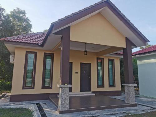 a small house is good enough for a family of four at Teratak Tuan Muda Homestay in Melaka