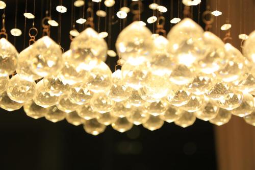 a bunch of crystals hanging from a chandelier at PJ Hotels Jaffna in Jaffna