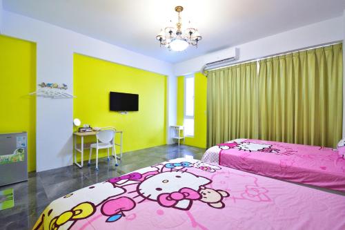 Postel nebo postele na pokoji v ubytování Haige Homestay
