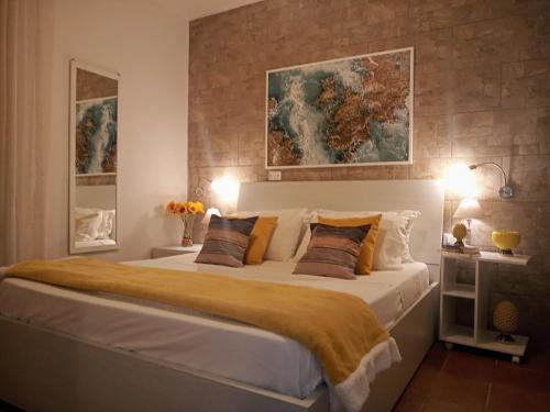מיטה או מיטות בחדר ב-Zisa Home ai Cantieri Culturali