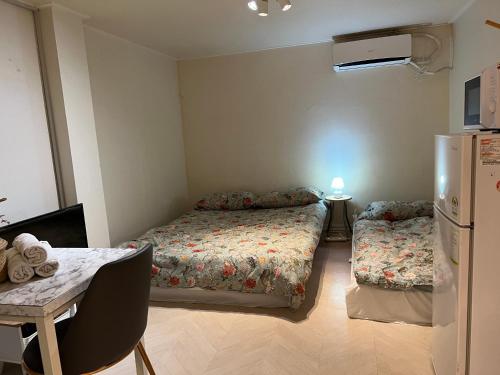 Ένα ή περισσότερα κρεβάτια σε δωμάτιο στο Rich House Dongdaemun