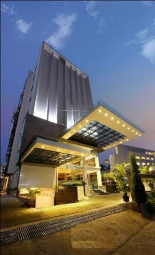 a large building with lights on top of it at Ginger Kochi MG Road in Cochin