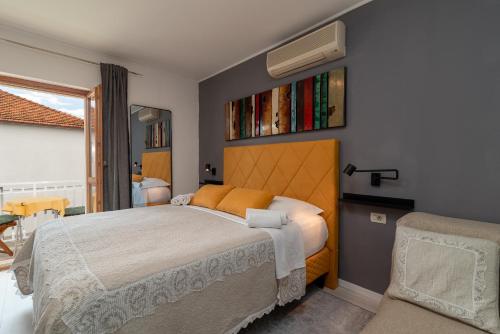 a bedroom with a large bed in a room at Villa Bakica in Trogir