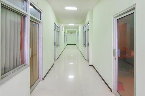 a corridor of an empty hospital hallway at Urbanview Hotel Bartu Moh Toha Bandung by RedDoorz in Bandung