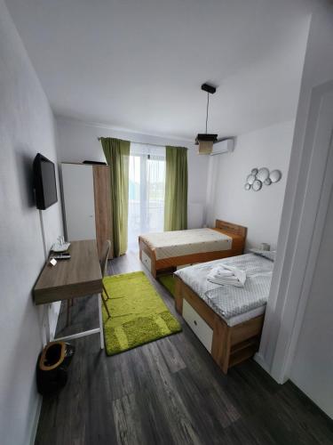 Ένα ή περισσότερα κρεβάτια σε δωμάτιο στο Armina's Residence 2