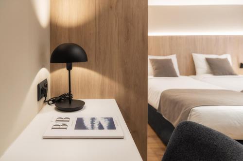 Postel nebo postele na pokoji v ubytování Hotel Montarto