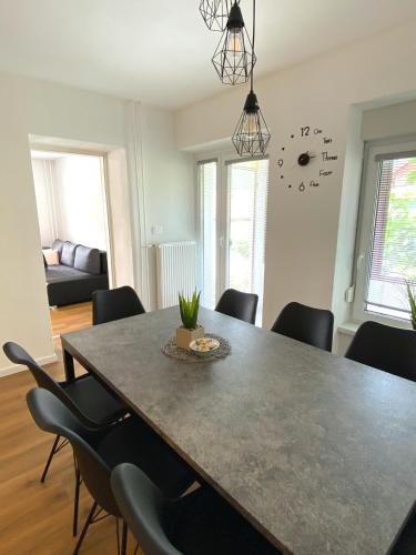a dining room with a table and chairs at Apartment Loyd, Tolmin - Most na Soči in Most na Soči