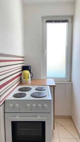 Η κουζίνα ή μικρή κουζίνα στο Apartments Tiho & Jelena
