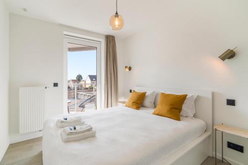 Säng eller sängar i ett rum på Maison Madison Nieuwbouw, terras, privé parking!