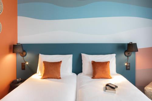 Ένα ή περισσότερα κρεβάτια σε δωμάτιο στο Ibis Styles Miramas