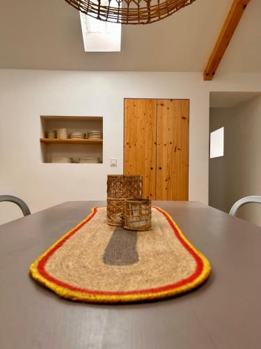 a table with a chair sitting on top of it at Palmeirinha Guest House in Sintra