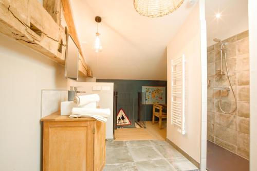 a kitchen with a sink and a refrigerator at La Belle lurette in Bressuire