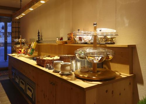a counter in a kitchen with a food at Hotel Alpenfrieden in Rio Bianco