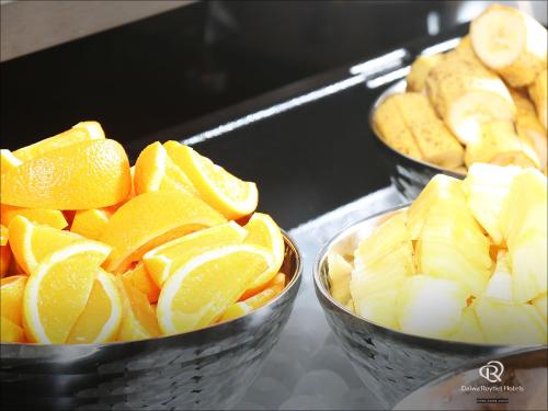 three bowls of fruit and vegetables on a table at Daiwa Roynet Hotel Tokushima Ekimae in Tokushima