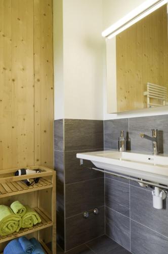 a bathroom with a sink and a mirror at BerglandHof Hotel Ernen in Ernen