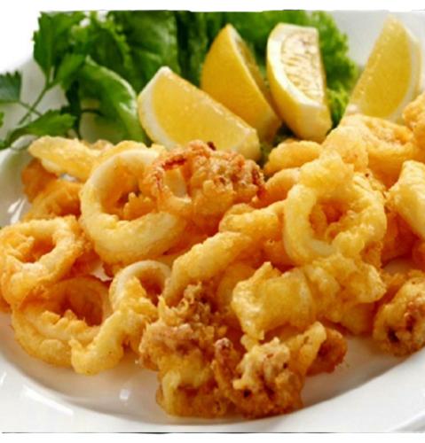 a plate of calamari with lemon slices and greens at Coralli Rooms & Restaurant in Elafonisos