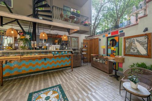a restaurant with a counter and a bar at The Marions Suite istanbul Special Category Taksim in Istanbul