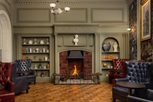 a fireplace in a living room with a fire place at Ensana Buxton Crescent in Buxton