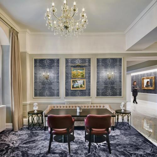 a pool table in a room with paintings at Ensana Buxton Crescent in Buxton