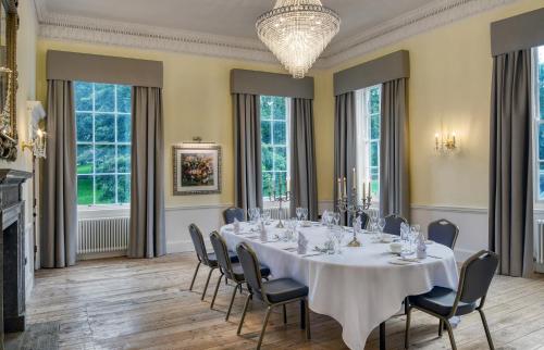 a large dining room with a table and chairs at Ensana Buxton Crescent in Buxton
