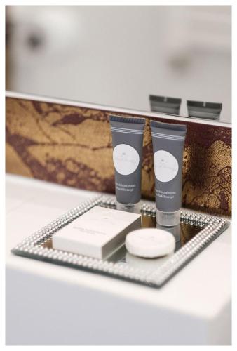 a shelf with two products on top of it at Centrum Eventowo- Konferencyjne Pałacyk Fantazja in Sięciaszka Pierwsza