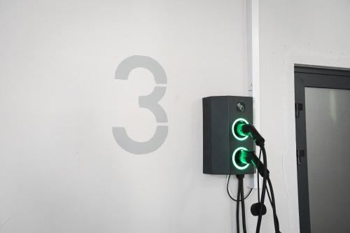 a sign with the number three on a wall at Rest&Ski Spa Resort in Bukovel