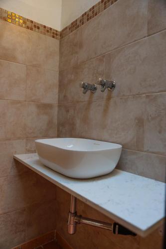 a white sink on a counter in a bathroom at Agricampeggio Paradiso in Brenzone sul Garda