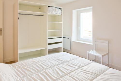 Postel nebo postele na pokoji v ubytování À 100m du port de Loctudy, bel appartement pour 6