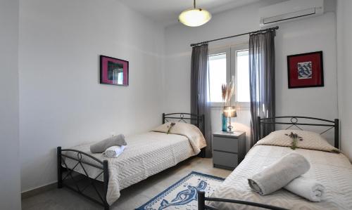 Ένα ή περισσότερα κρεβάτια σε δωμάτιο στο Dreamscape Villa Kea