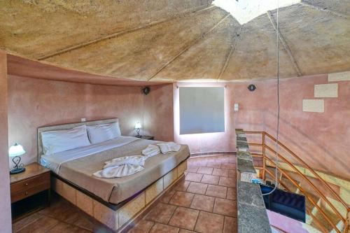 a bedroom with a large bed in a room at Anemomili Village in Kissamos