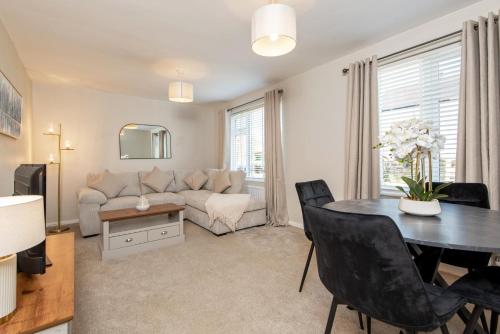 a living room with a couch and a table at Broome Road in Durham