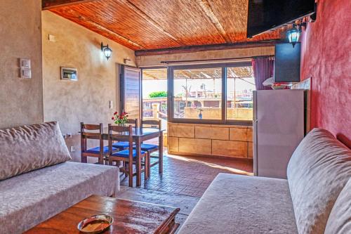 a living room with a couch and a table at Anemomili Village in Kissamos