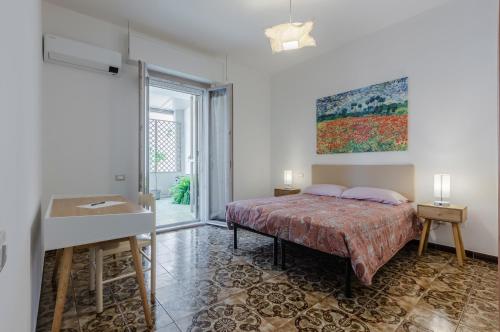 Postelja oz. postelje v sobi nastanitve Cagliari Comfy Apartment with Terrace & Netflix!