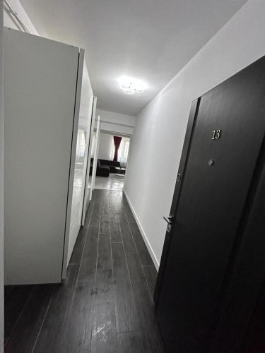 a hallway of an empty room with a hallway at Marvellous Aparthotel with Master Apartments Suceava in Suceava