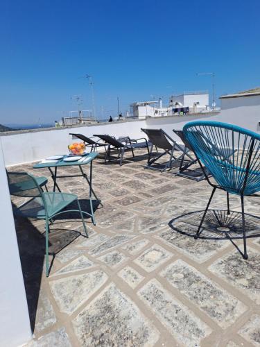 a group of chairs and tables on a patio at Palazzo AD 1892 - SUITES & SPA in Ostuni