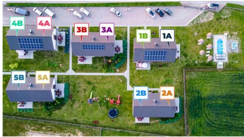 an overhead view of houses with numbers on them at Słoneczne Wzgórze Zator in Zator