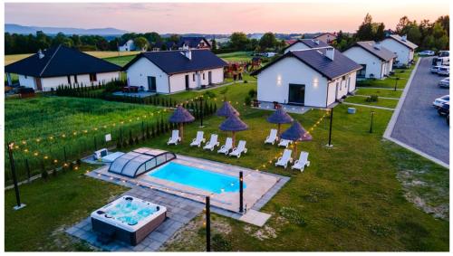 an aerial view of a house with a swimming pool at Słoneczne Wzgórze Zator in Zator