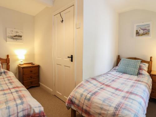 Postel nebo postele na pokoji v ubytování Llygoden Cottage