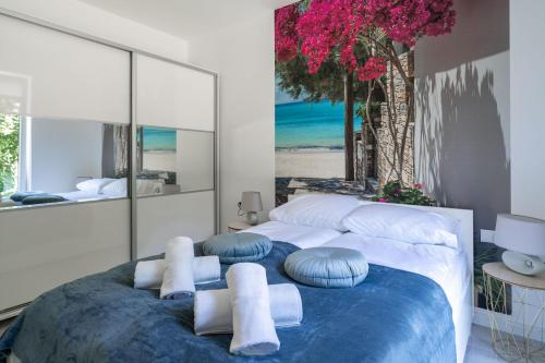 a bedroom with a large bed with pillows on it at Apartamenty Olchowa z tarasem w spokojnej okolicy - Dream Apart in Ustroń