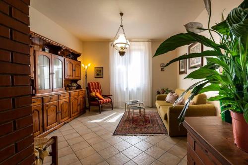 a living room with a couch and a chair at Casa vacanze Santa Maria in Certaldo