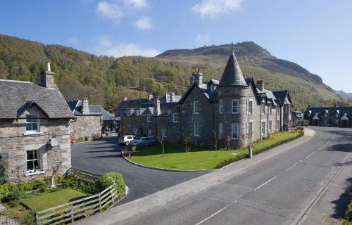 an old house on the side of a street at Dunalastair Hotel Suites in Kinloch Rannoch